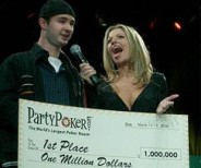 Mike Schneider happily accepts a check for $1 million after winning PartyPoker's Million V Tournament