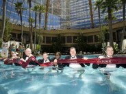 Harrah's executives take the first dip in a new 86,000-gallon pool that opened with a 'splash' on Friday, May 25.
