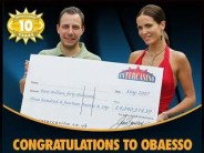 Obaesso receives his £4.04 million online jackpot cheque.